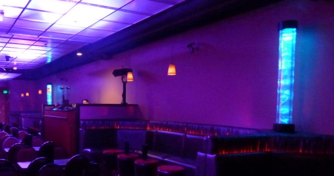 Lounge interior with tall blue illuminated columns